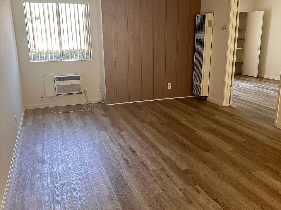 Front entrance looking at living room, bedroom door to the right
