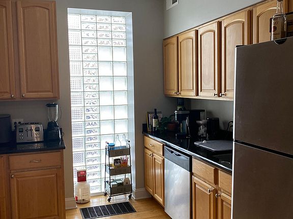 Upgraded kitchen with natural light and stainless steel appliances