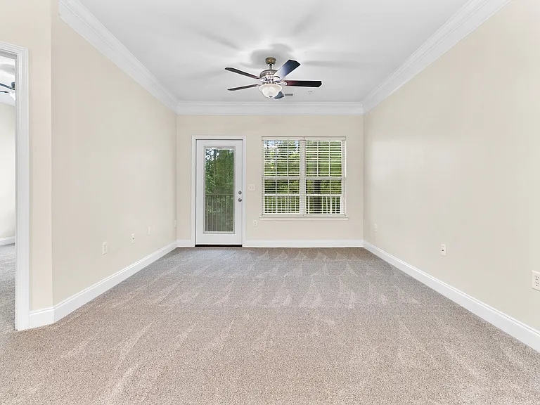 Living room and access door to the screened-in porch/balcony