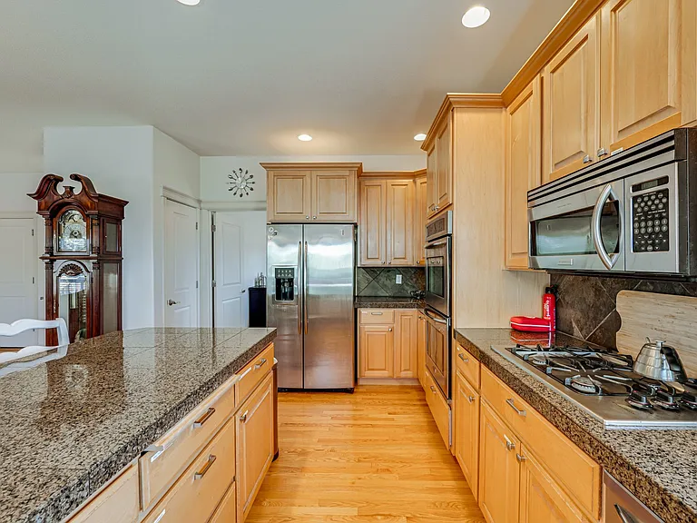 Gas stove, double oven, microwave, island/bar, LOTS of cabinet and counter space