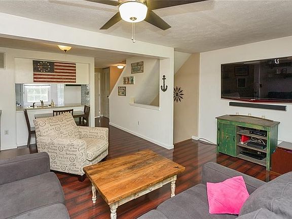 The large and open living room can accommodate all of your furniture and offers easy to maintain flooring.