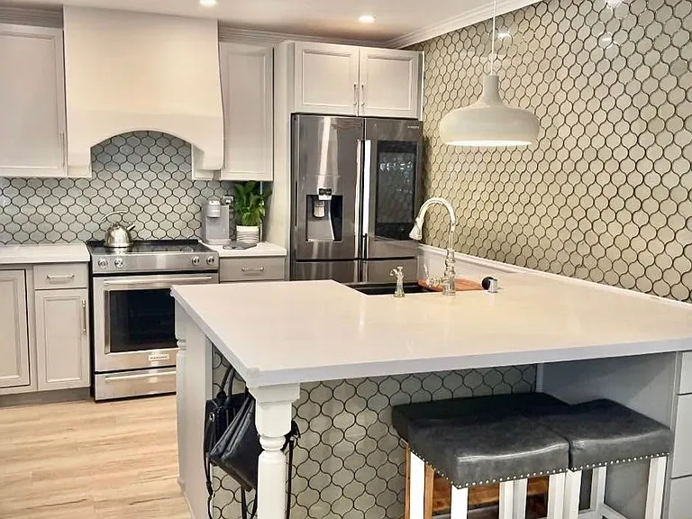Fully upgraded kitchen with premium appliances & custom cabinetry.