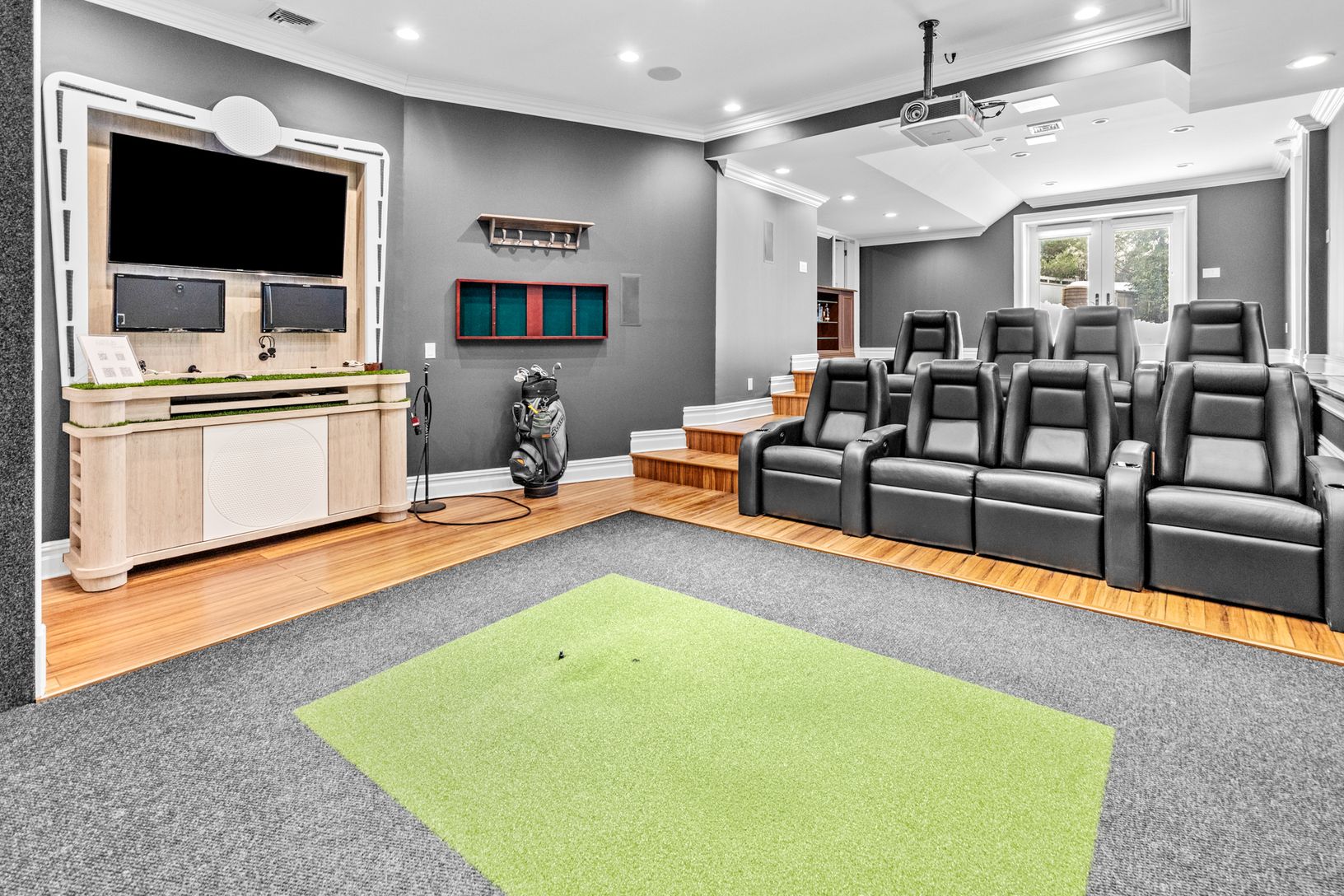  media room with golf simulator
