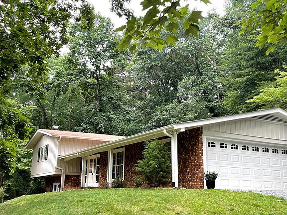Attached two-car garage with large storage room for bikes, skis, strollers, and all your stuff! (new concrete driveway installed 2024, not pictured!)