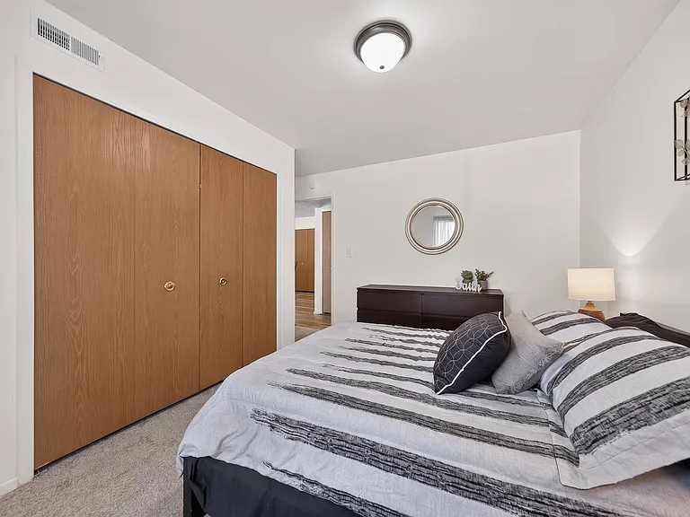 Bedroom with ample storage space at Eastwood Village Apartments in Clinton Township, MI.