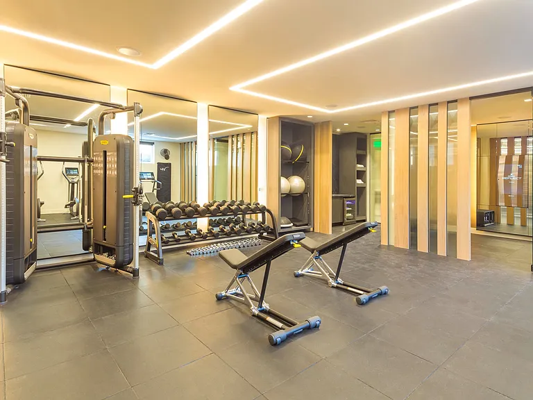 Made for happiness and health, our first-floor wellness center features top-tier mirror technology, Technogym equipment, TRX systems, and private workout spaces all in a spa-like atmosphere