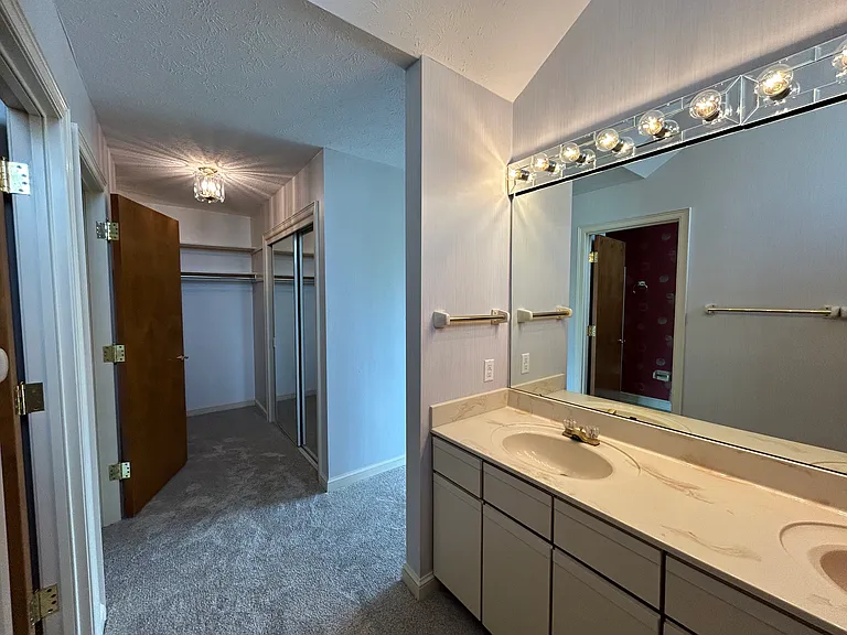 Sections for vanity, dressing room, and water closet