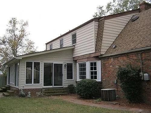 back of house / large sun porch (opens to both kitchen and dining room)