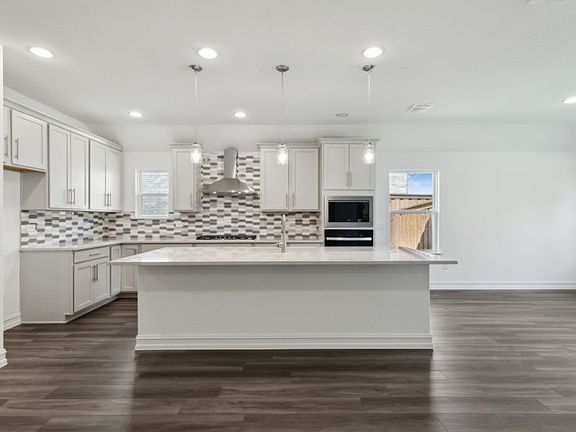 Eat-in bartop island with pendant lighting