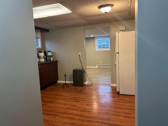 View of the kitchen and living room coming from the bedroom