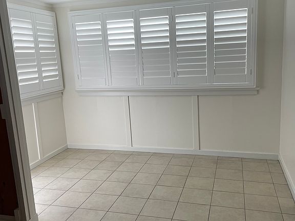 Front door (shown) and rear door. 
New Plantation Shutters throughout and recessed lighting
Room for daybed or office