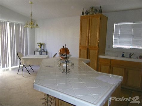 Large kitchen island that opens to living & dining area.