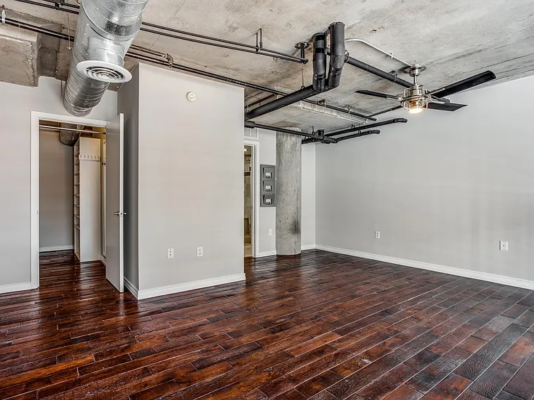 Retreat to the upstairs bedroom, complete with an en-suite bathroom and walk-in closet, offering privacy and convenience in a luxurious setting.