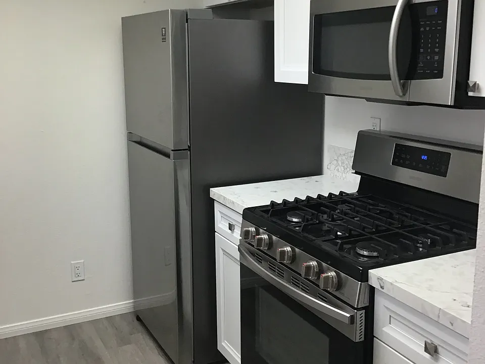 Refrigerator with ice Machine, self cleaning gas range, misrowave