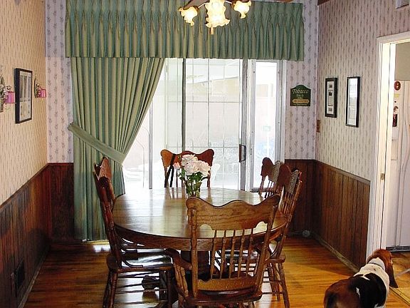Formal Dine w/wood floors & open beam ceiling