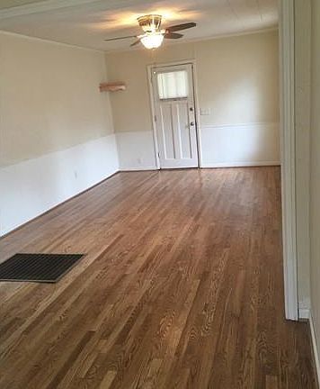 Living Room. Newly refinished oak floors in this living/dining room combination.