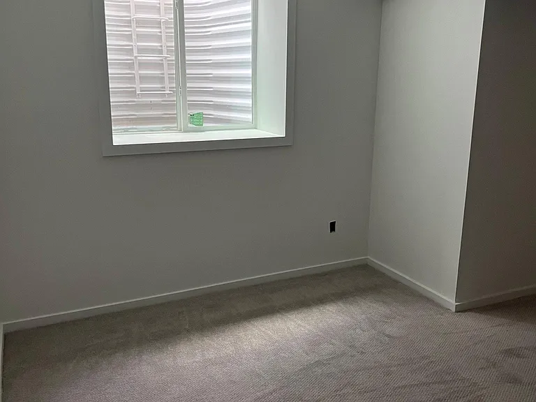 20' x 12', Light, airy bedroom; brand new painting, carpeting, window; spacious closet.