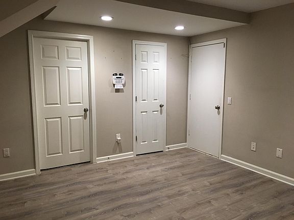 Bonus Room - Lower Level - Right Door to Garage. Center Door to 1/2 Bath. Left Door to Laundry Room.