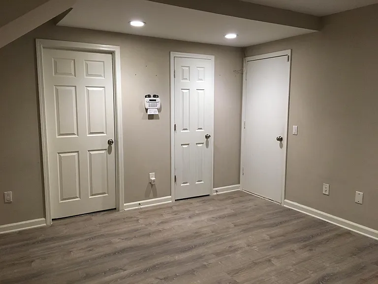 Bonus Room - Lower Level - Right Door to Garage. Center Door to 1/2 Bath. Left Door to Laundry Room.