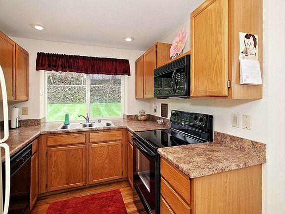 Kitchen overlooks backyard