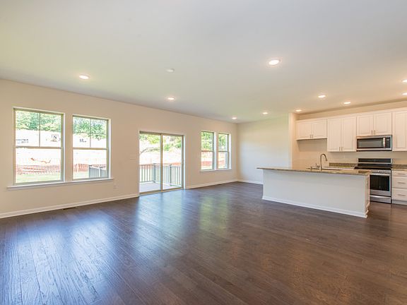 Open layout featuring the kitchen island with additional seating