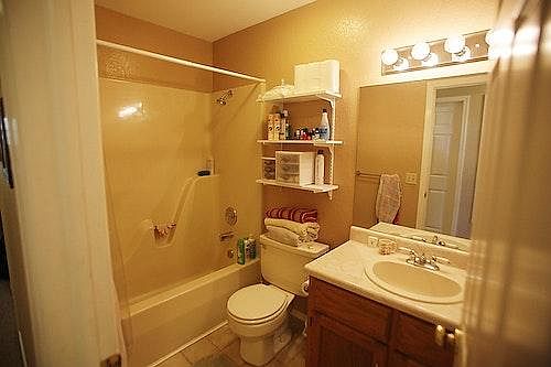 Hallway bathroom with full tub
