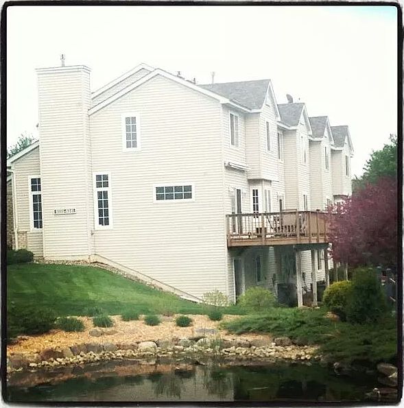 Exterior shot 3- finished walk out basement with pond view