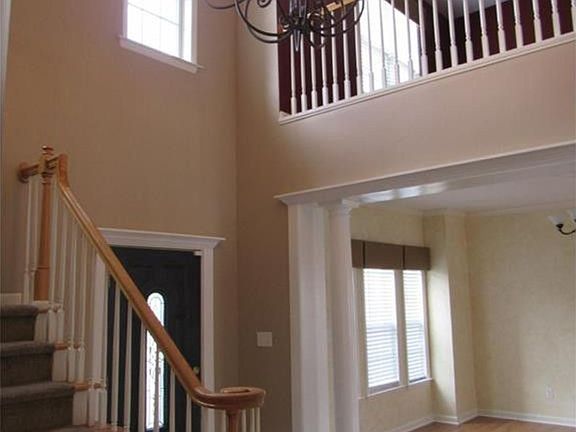 Two story foyer with view of loft/office area.