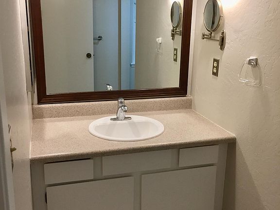Bathroom vanity - new flooring, fresh paint throughout.