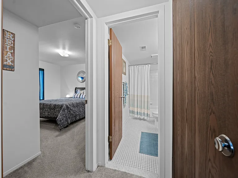Bedroom/bathroom at Westwood Village Apartments in Westland, MI