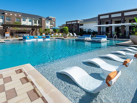 Resort-style pool with lounge seating
