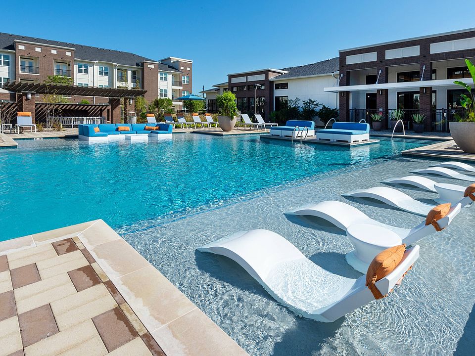 Resort-style pool with lounge seating