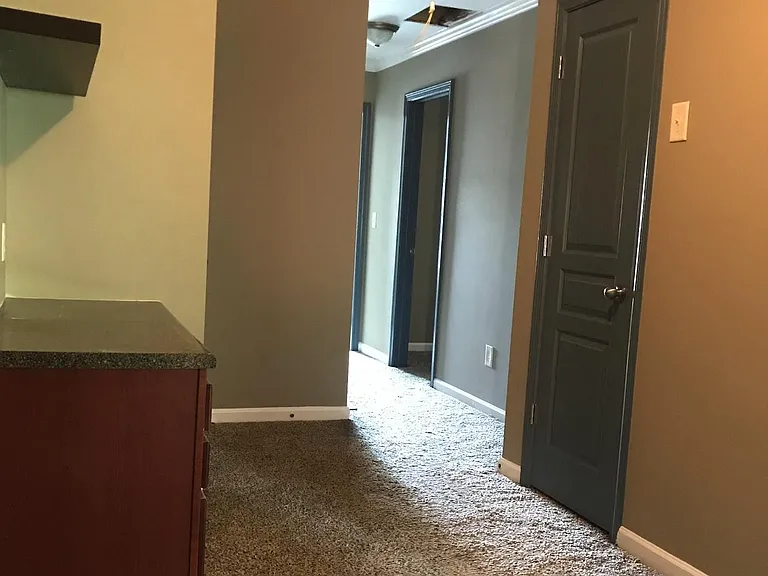 top of stairs looking down hallway.
