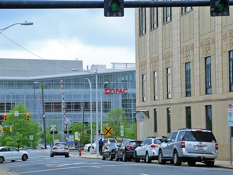 Steps away from DPAC and America Tobacco, Bar Virgil and man