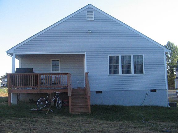 Rear w/ partially covered deck