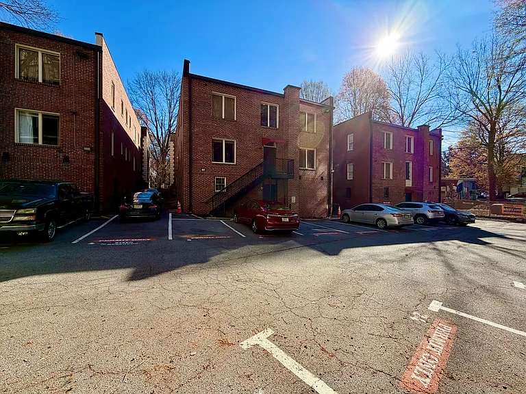 Off street permitted parking! Laundry room is located just in adjacent building to the right.
