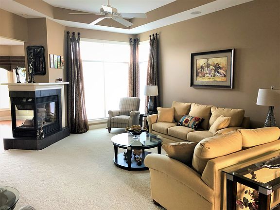 LR with 3-way fireplace.