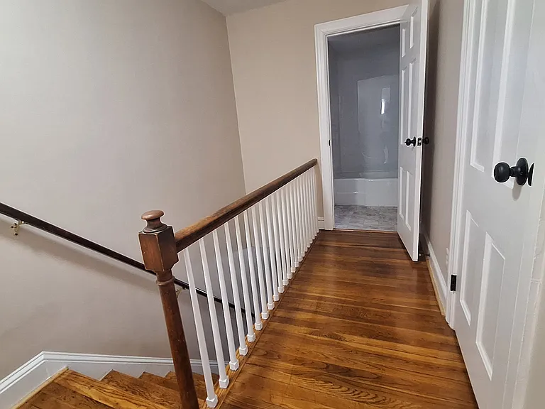 Hallway with closet on right