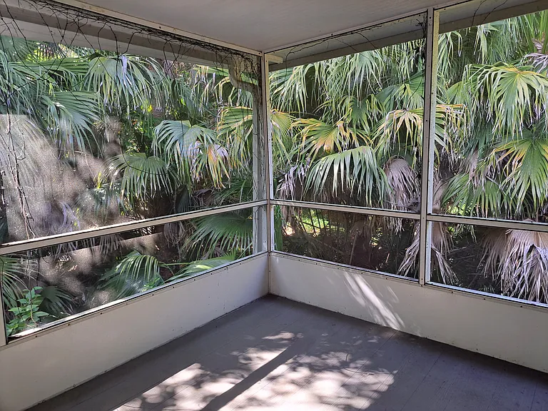Large screened in porch is like being in your own private treehouse.