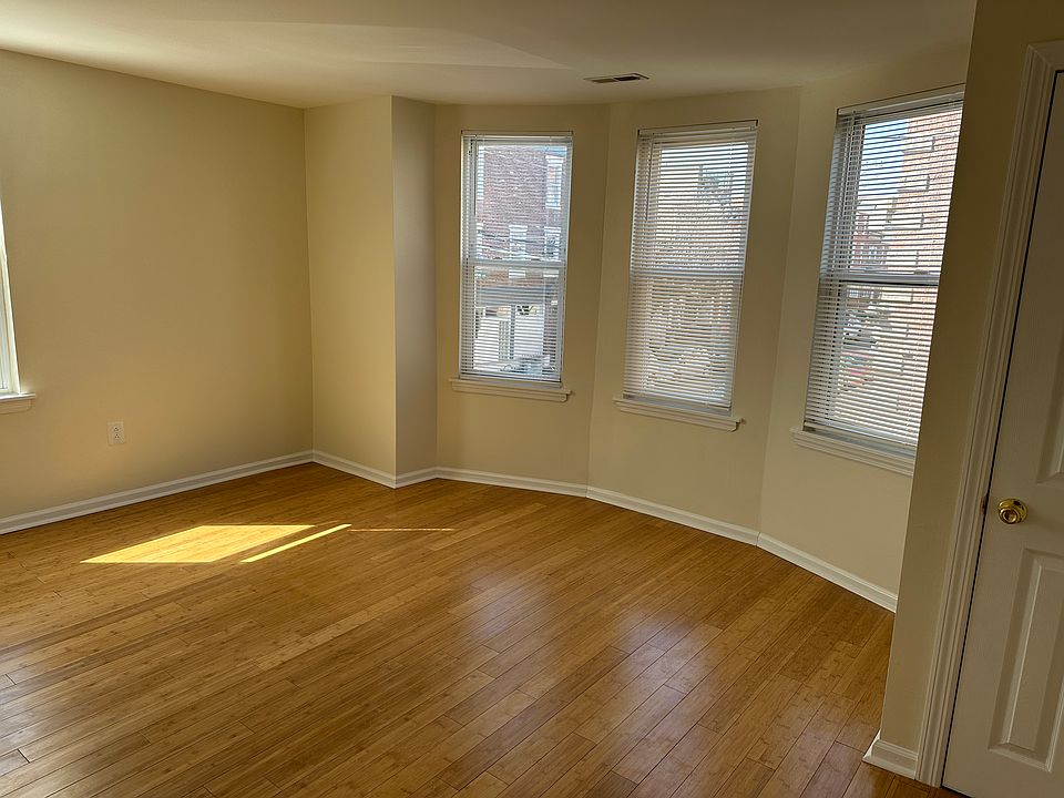 Spacious master bedroom with 4 windows