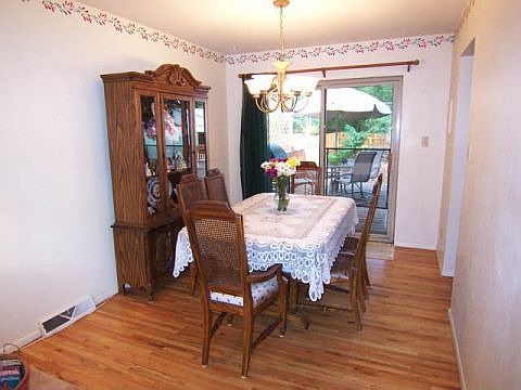 Wonderful walk out dining room with hardwood floors.