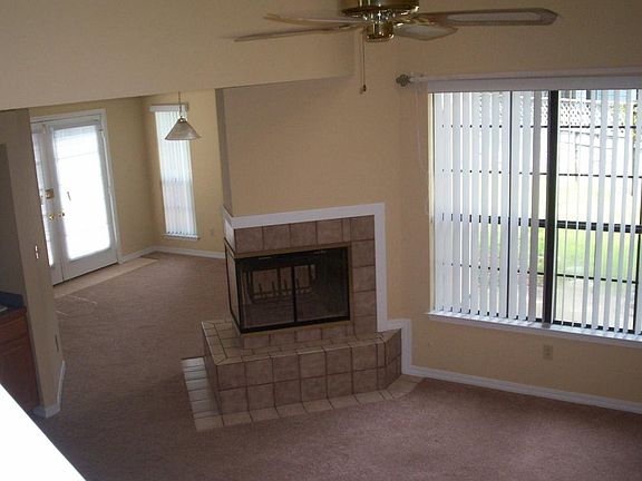 Living room/see-thru gas fireplace from upstairs balcony