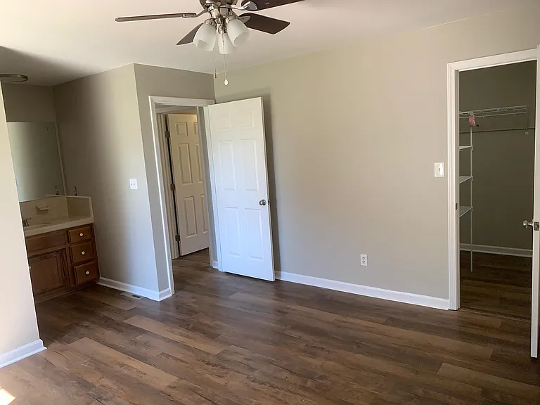 Master Bedroom with walk in closet and full bath room with shower only