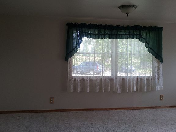 Living room view one with picture window.