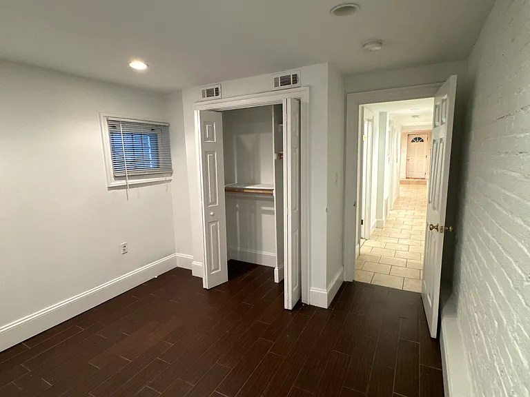 Large closet with double shelves.