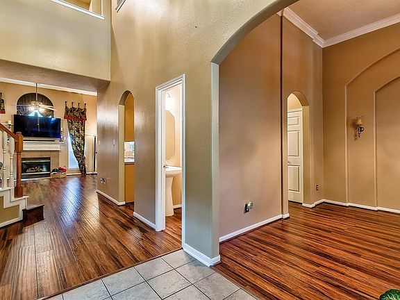 Formal Dining Room and Powder Room to Right of Entry