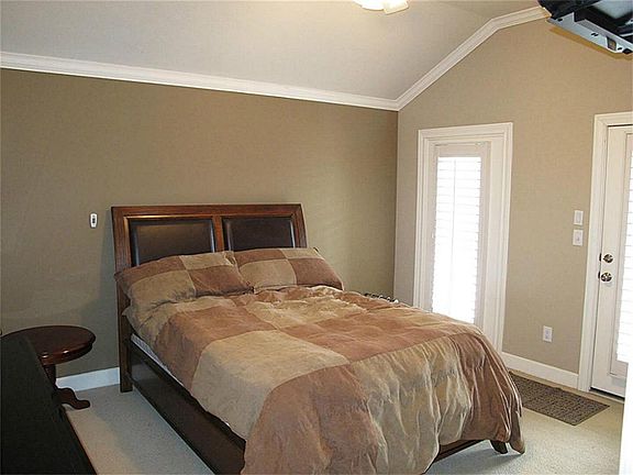 Spacious secondary bedroom sizes! Both feature crown millwork, plantation shutters, & neutral carpet along with ample storage space!
