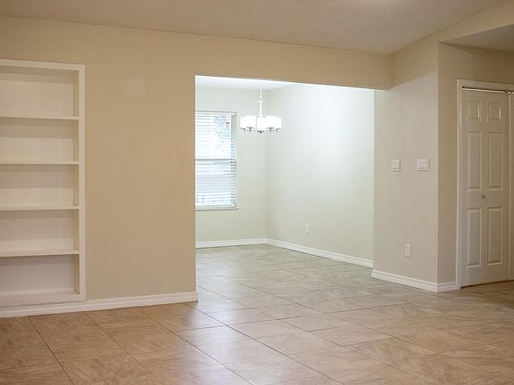 Living room looking into dining room area.