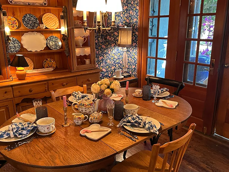 Hutch is filled with vintage entertaining items to add. to the appeal