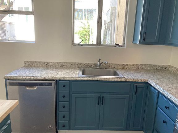Kitchen with dishwasher and lots of windows